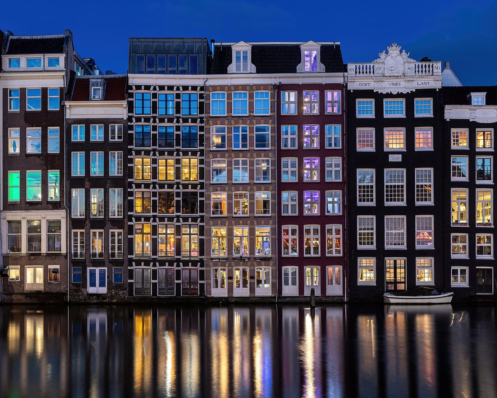 Canal houses reflected in Amsterdam’s waterfront