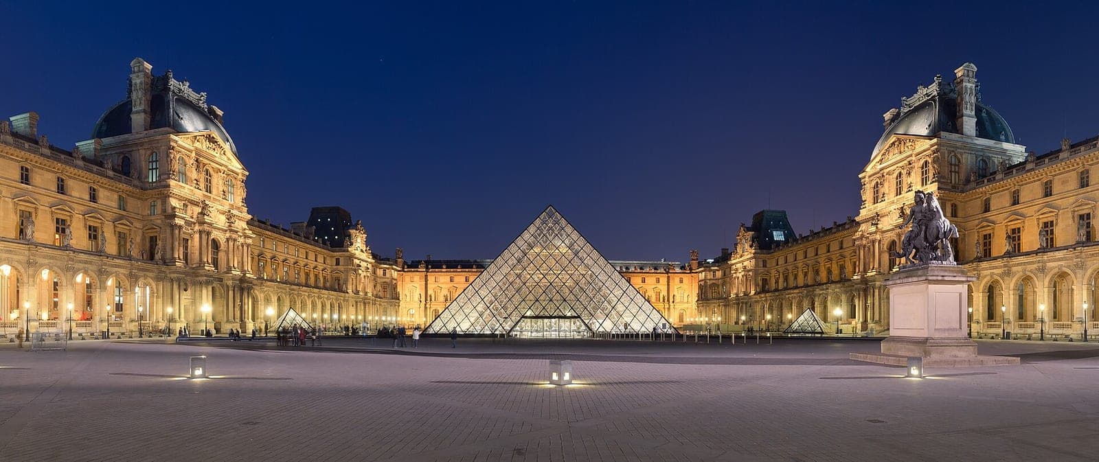 The illuminated Louvre courtyard in Paris