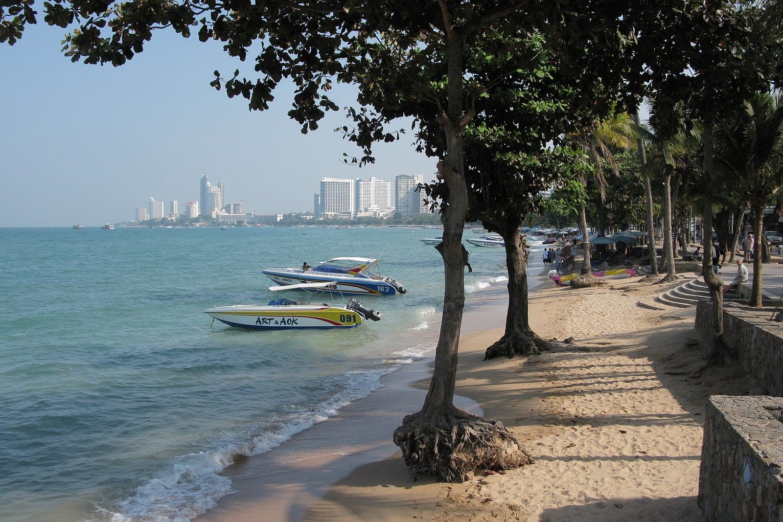 The tree-lined shore of Pattaya Beach