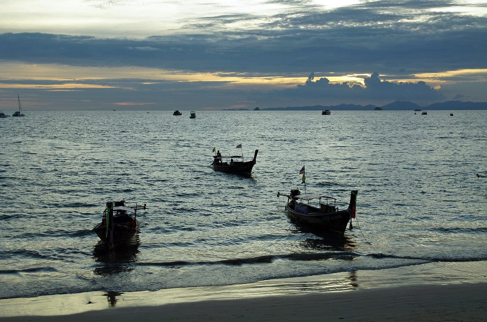 Long-tail boats at sunset on Ao Nang Beach