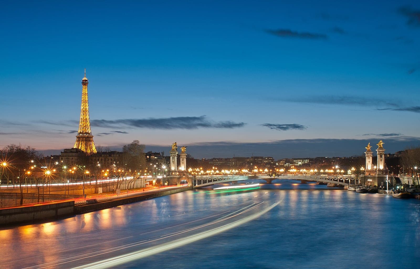 The Eiffel Tower and the Seine at night